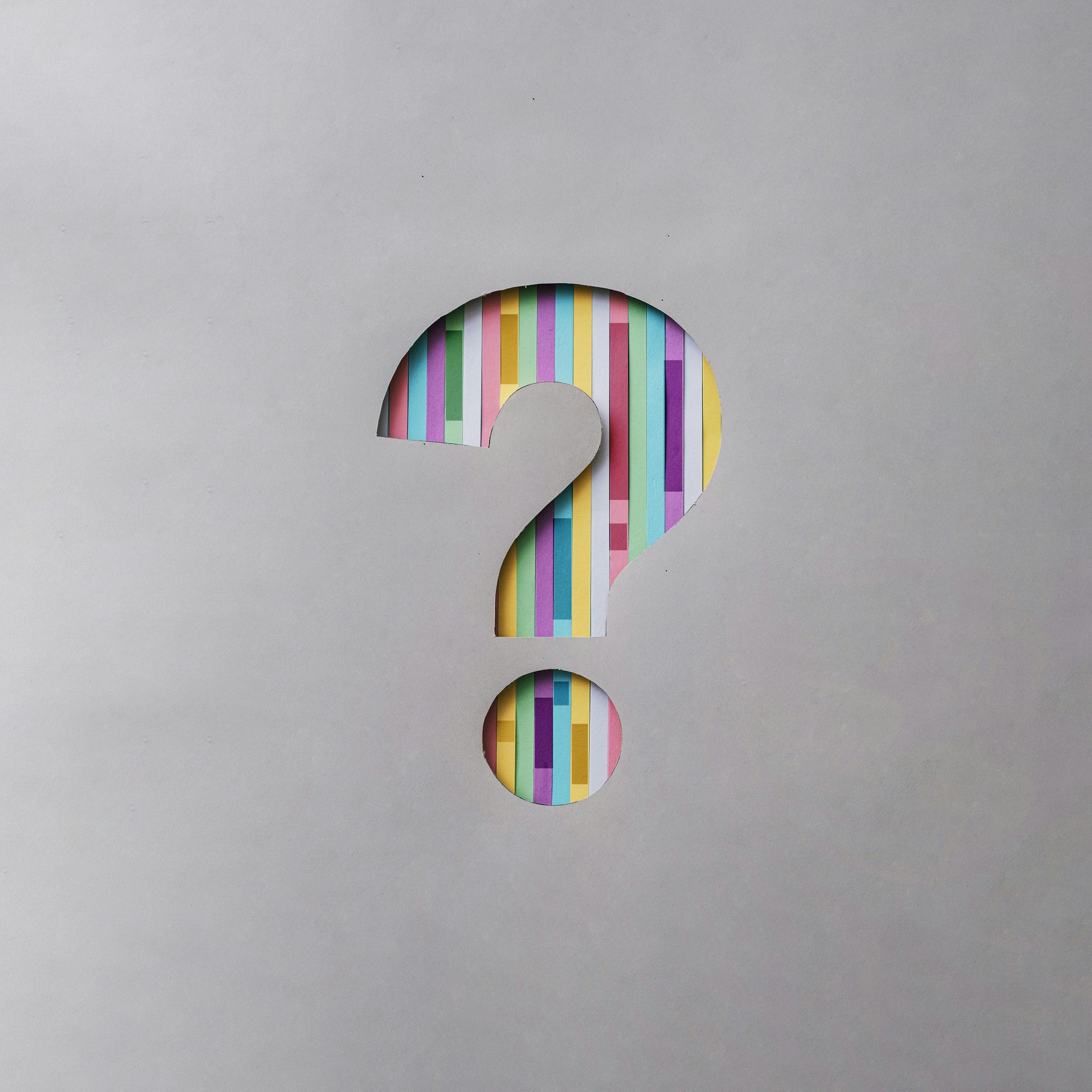 Colored question mark on gray background